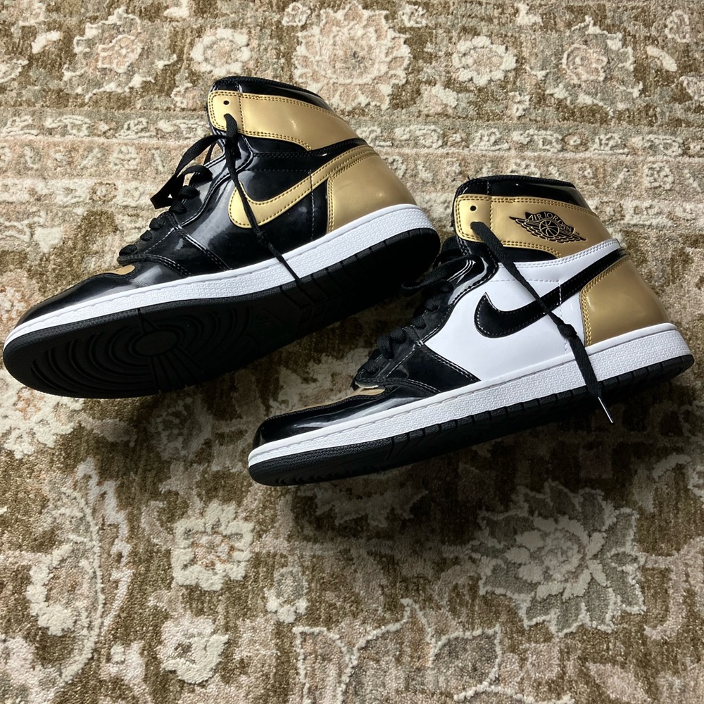 Nike Black and Gold Sneakers with Classic Design